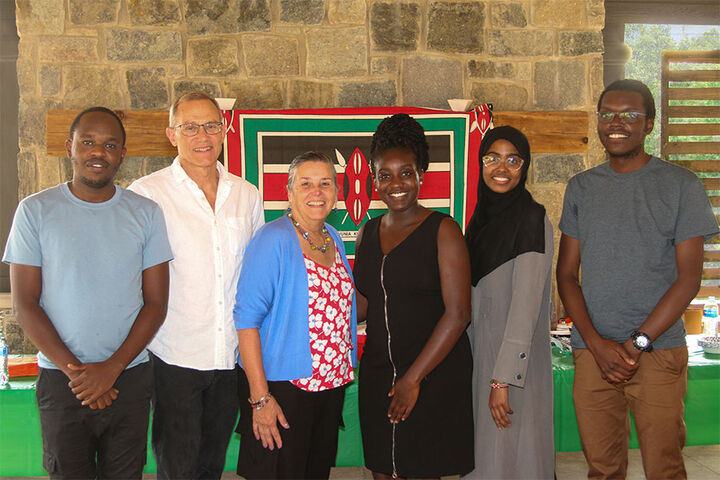 Robert and Lea Anne Einterz stand with Kenyan medical students.